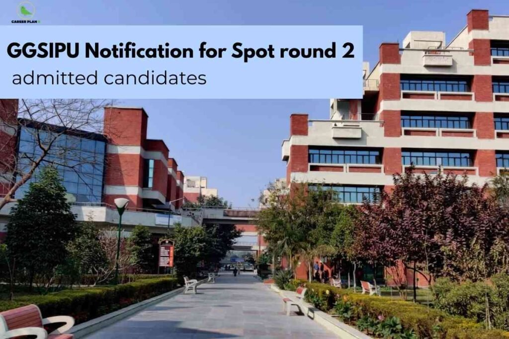 The image displays the modern campus buildings of Guru Gobind Singh Indraprastha University (GGSIPU) under a clear blue sky, creating a professional and academic setting. A blue banner across the top states, “GGSIPU Notification for Spot round 2 admitted candidates.”