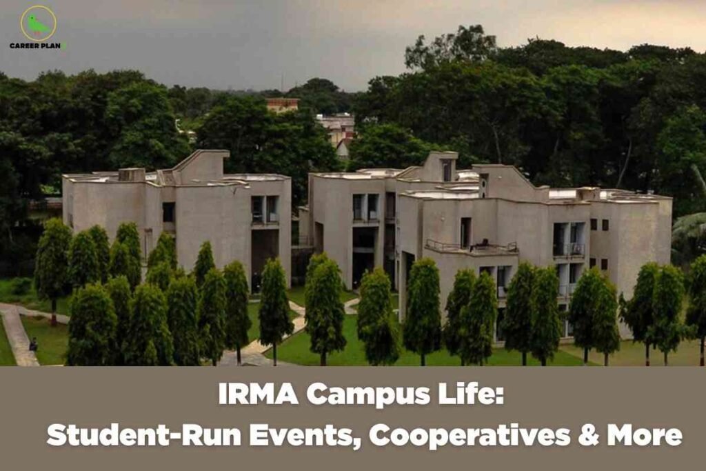 Modern concrete residential complex with multiple stories and balconies surrounded by landscaped green lawns and uniformly planted trees under cloudy sky displaying white text "IRMA Campus Life Student-Run Events Cooperatives & More" with Career Plan B logo representing Institute of Rural Management campus environment and community-based learning experience