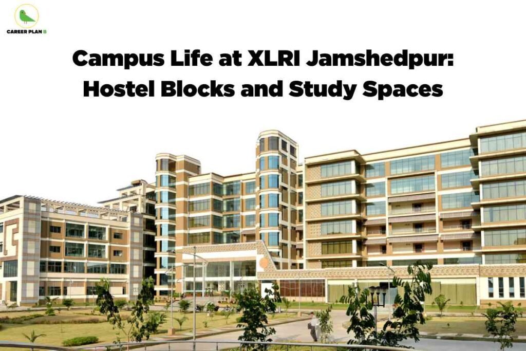 A high-resolution photo of the XLRI Jamshedpur campus shows a sprawling, modern academic building with a mix of tan and white colors, large glass windows, and multiple levels. The architectural style features rounded vertical columns and open terraces. The building is set amid landscaped grounds with trimmed lawns, small trees, bushes, and paved walkways. A few people are visible walking along the paths, contributing to a sense of campus life. The upper left corner has the Career Plan B green bird logo and name. Centered at the top, bold black text says, "Campus Life at XLRI Jamshedpur: Hostel Blocks and Study Spaces." The scene communicates a lively, well-maintained environment ideal for student accommodations and study.
