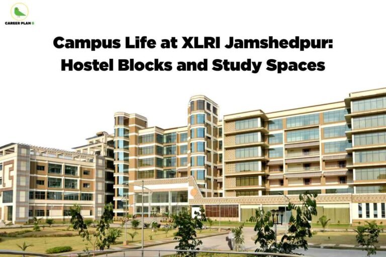 A high-resolution photo of the XLRI Jamshedpur campus shows a sprawling, modern academic building with a mix of tan and white colors, large glass windows, and multiple levels. The architectural style features rounded vertical columns and open terraces. The building is set amid landscaped grounds with trimmed lawns, small trees, bushes, and paved walkways. A few people are visible walking along the paths, contributing to a sense of campus life. The upper left corner has the Career Plan B green bird logo and name. Centered at the top, bold black text says, "Campus Life at XLRI Jamshedpur: Hostel Blocks and Study Spaces." The scene communicates a lively, well-maintained environment ideal for student accommodations and study.