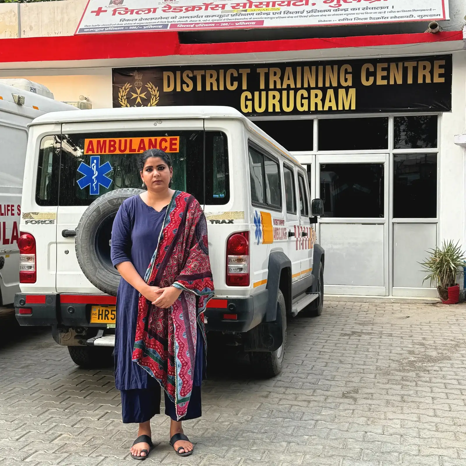 Career Plan B founder Shahnaz Hussain standing in front of an ambulance at the District Training Centre Gurugram.