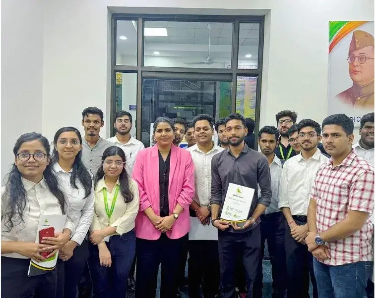 Career counsellors with working professionals holding certificates after a training session in an office.